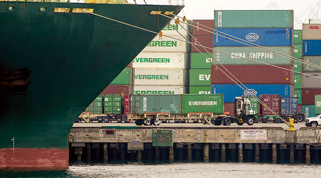 A terminal tractor moves containers at the Port of Los Angeles.