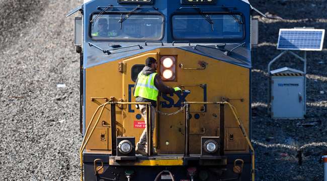 A CSX Corp. locomotive stops to switch tracks