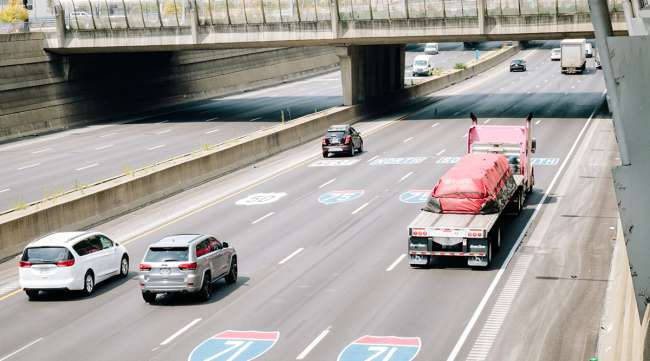 Vehicles travel along a highway in Cincinnati