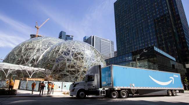 An Amazon Prime truck delivers an Australian fern to Amazon’s campus for the ceremonial first planting at The Spheres in Seattle.