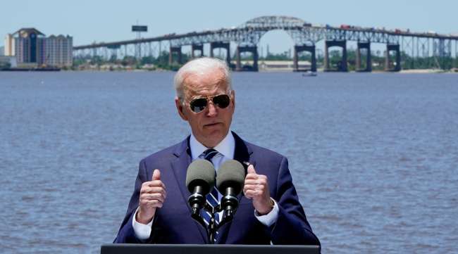 President Joe Biden speaks in Lake Charles, La., on May 6, with the Interstate 10 Calcasieu River Bridge behind him. (Alex Brandon/Associated Press)