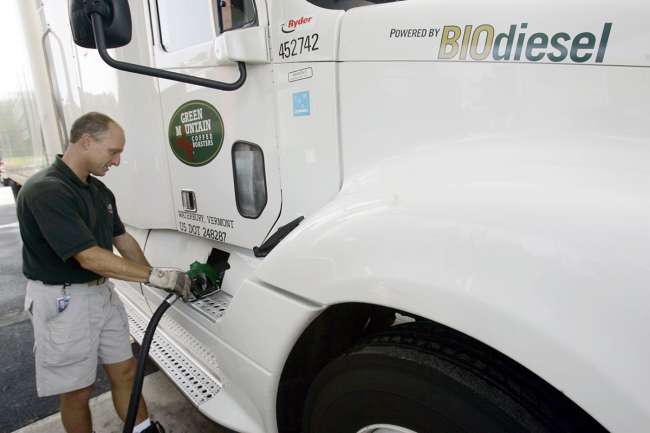 Green Mountain Coffee Roasters driver Todd Jones pumps biodiesel onto a company truck.