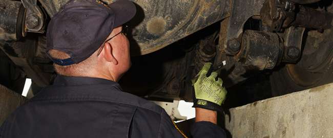 An inspector takes a look at truck brakes
