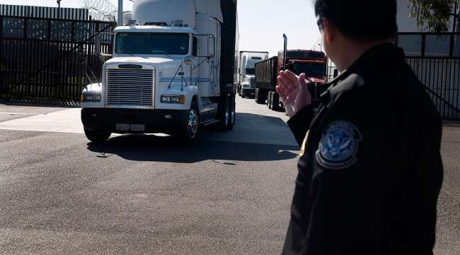 Trucks cross the U.S.-Mexico border at Otay Mesa.