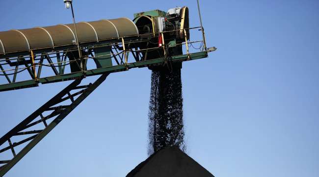 Metallurgical coal is loaded onto a barge in Ceredo, W.Va. (Luke Sharrett/Bloomberg News)
