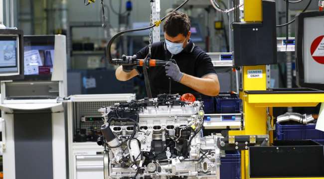 An employee assembles a Mercedes-Benz automobile in Germany on April 22.