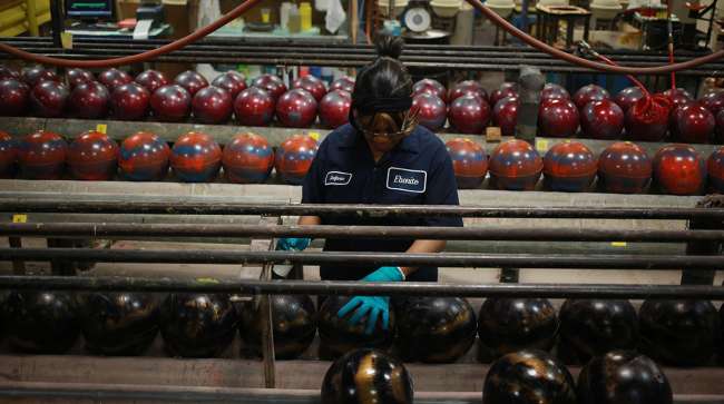 factory worker with bowling ball
