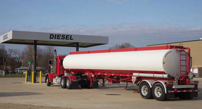 Tanker truck at a fueling station