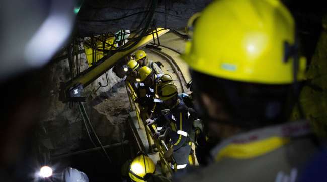 Workers enter the Gran Colombia Gold Corp. mine in Colombia on Jan. 27.