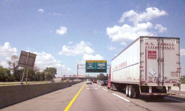 Vehicles travel up to an express toll on the New Jersey Turnpike