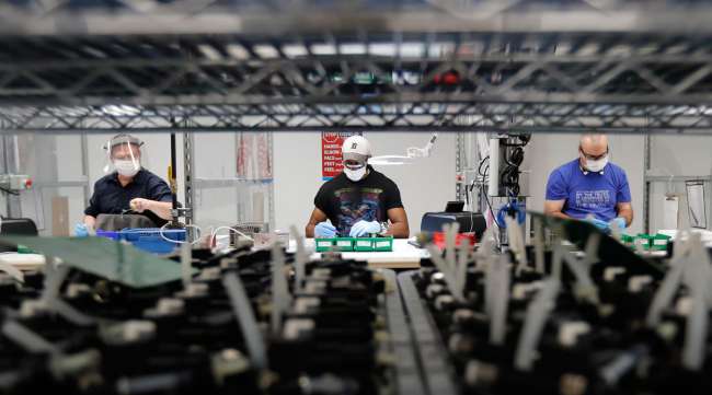 Ford workers assemble ventilators in Michigan.