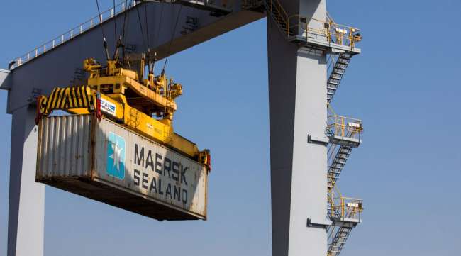A crane carries a Maersk shipping container at London Gateway port on Sept. 22.
