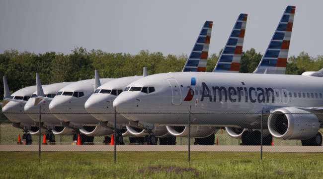American Airlines Boeing 737 Max planes sit parked outside a hangar in Tulsa, Okla., in May 2019.