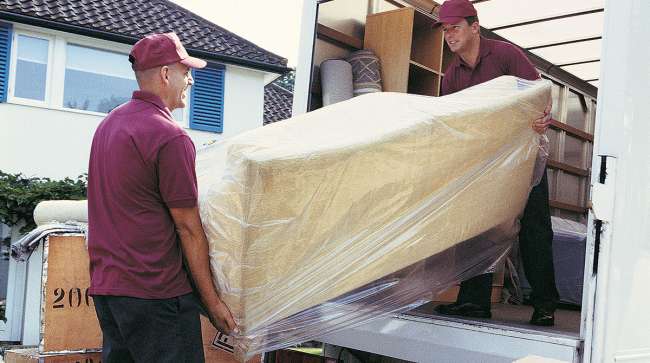 Movers loading a van