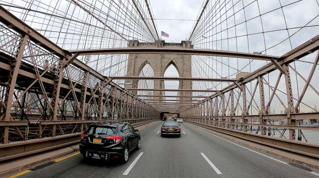 Traffic crosses the Brooklyn Bridge into Manhattan