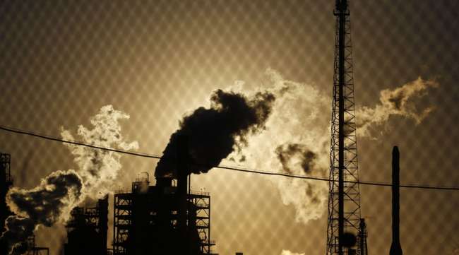 Emissions rise from an oil refinery in Norco, La., in June 2020. (Luke Sharrett/Bloomberg News)