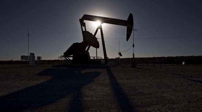 The silhouette of a pumpjack in the Permian Basin near Orla, Texas. (Daniel Acker/Bloomberg News)