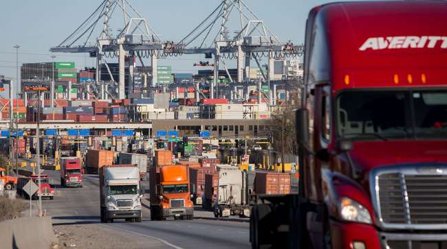 Tractor-trailers move cargo out of the Port of Savannah.