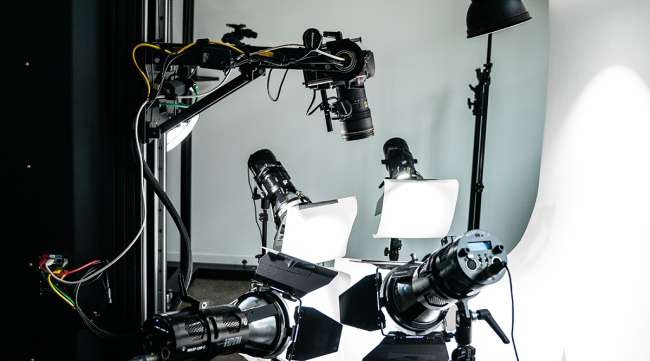 A camera and lighting equipment set up at Sqaure Ecom's photo studio