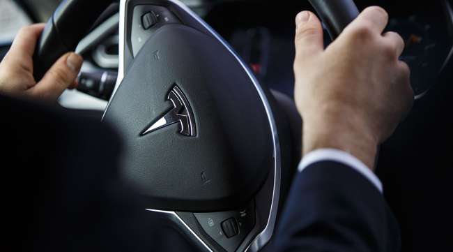 The steering wheel of an Uber Technologies Tesla Model S electric automobile