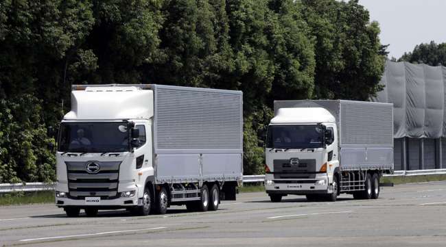 Hino Motors autonomous trucks travel in convoy during a demonstration in Japan.