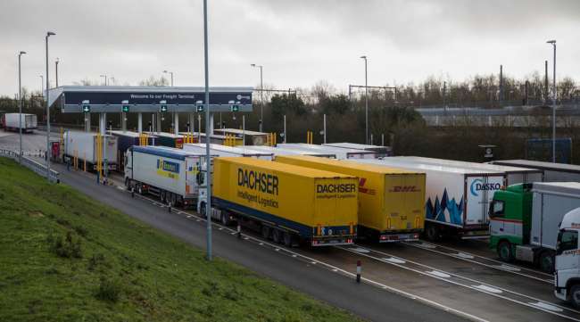 Trucks wait at the check-in for the channel tunnel in Folkestone, U.K.