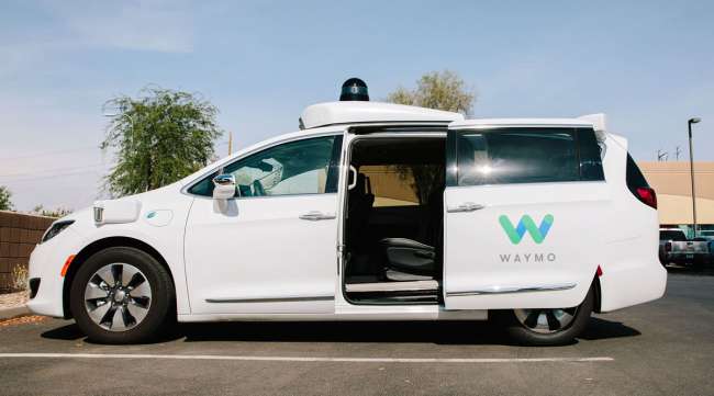 A Waymo Chrysler Pacifica autonomous vehicle sits parked in Chandler, Ariz., in July 2018.