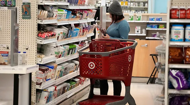 A Target shopper checks out an item