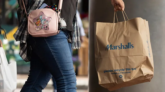A shopper carries a Marshalls bag in Boston
