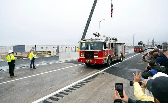 A fire engine is the first to cross the reopened section of I-95 in Philadelphia