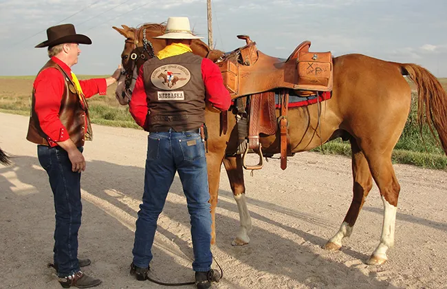 A rider prepares to mount up in Nebraska for the Pony Express