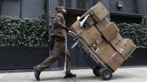 A UPS worker delivers packages 