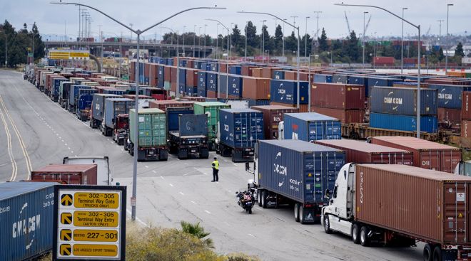 Trucks wait to enter the Port of Los Angeles