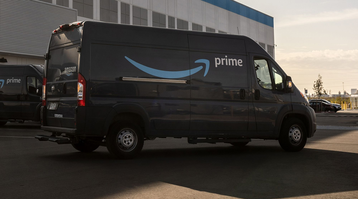 Delivery vans at an Amazon facility