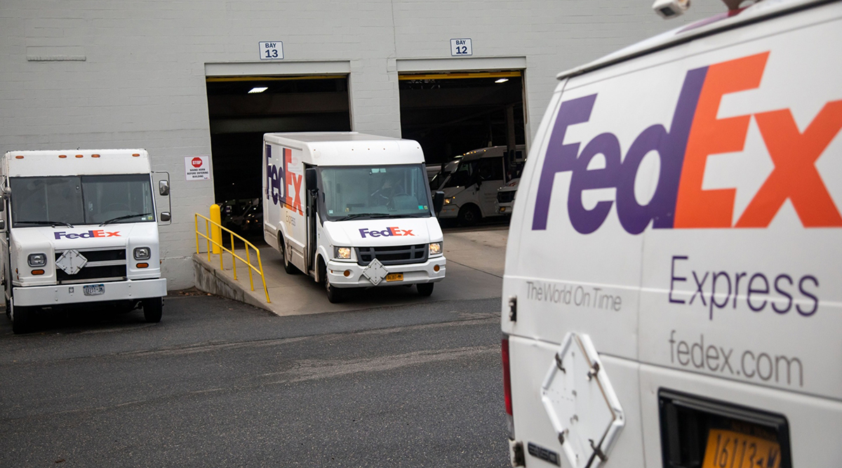 A delivery truck leaves a FedEx Express facility