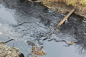 Oil from the Keystone pipeline rupture flows into Mill Creek