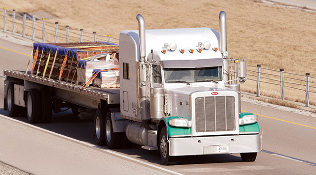 Flatbed truck hauling freight