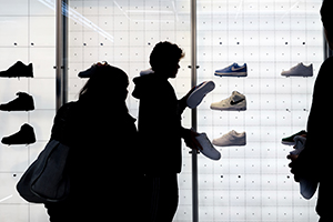 People shop for shoes in a Nike store