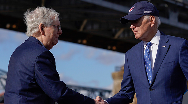 President Biden shakes hands with Mitch McConnell