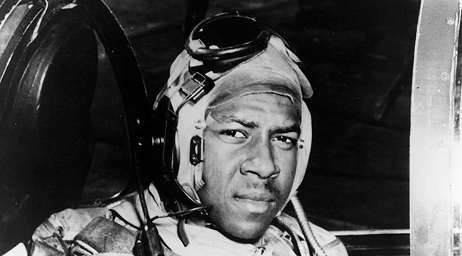 Jesse Brown in the cockpit of an F4U-4 Corsair fighter