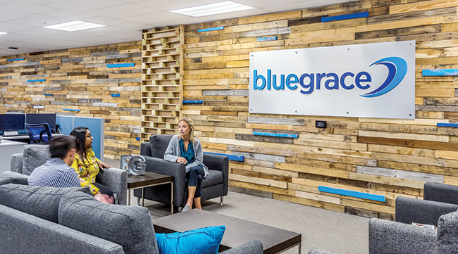 BlueGrace Logistics employees talk in a lounge area at their office