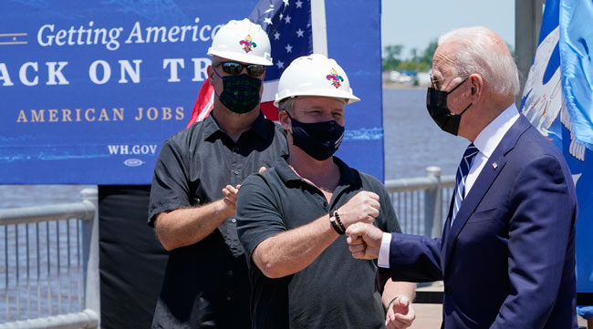 President Joe Biden greets people as he arrives to speak in Lake Charles on May 6. (Alex Brandon/Associated Press)