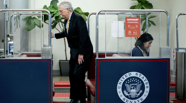 Senate Minority Leader Mitch McConnell boards the Senate Subway on May 26. (Stefani Reynolds/Bloomberg News)