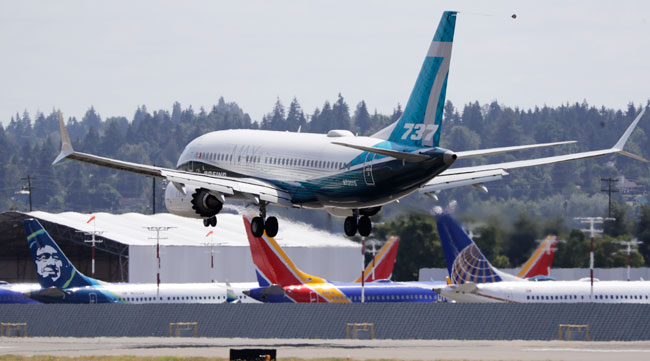 A Boeing 737 Max jet heads to a landing after a test flight in Seattle June 29.