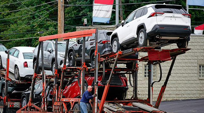 New cars are delivered to a dealer in Pittsburgh