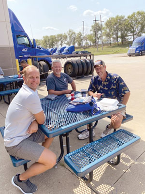 American Central Transport drivers smile during a company cookout. (American Central Transport)