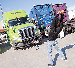 Siphiwe Baleka, owner of Fitness Trucking, demonstrating an exercise