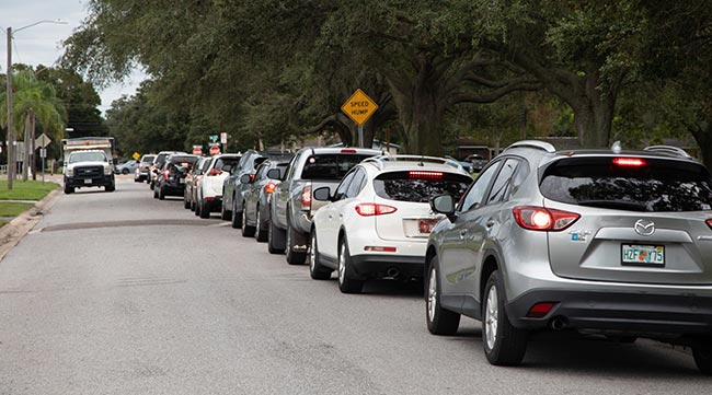  Cars line up to collect sandbags ahead of Hurricane Ian in St. Petersburg, Fla.