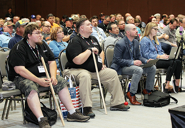 Attendees at an FMCSA session at MATS listen to a presentation