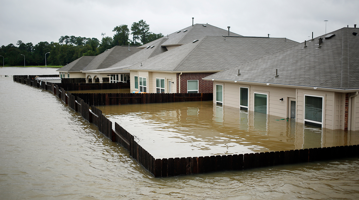 Houses at the Highland Glen subdivision stand in floodwaters due to Hurricane Harvey in Spring, Texas, U.S., on Monday, Aug. 28, 2017.